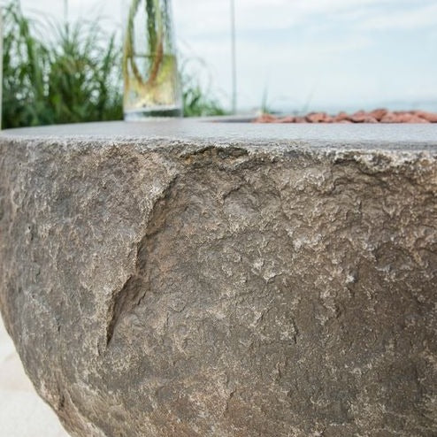 Elementi Boulder fire pit table edges and texture in outdoor