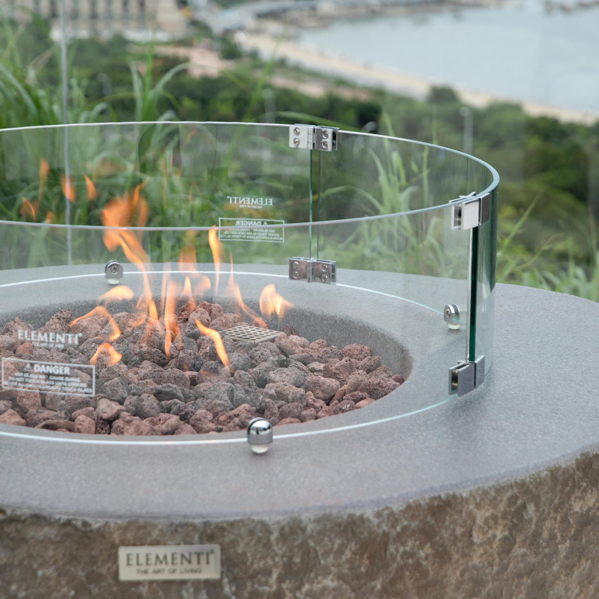 Elementi boulder fire pit table with wind screen